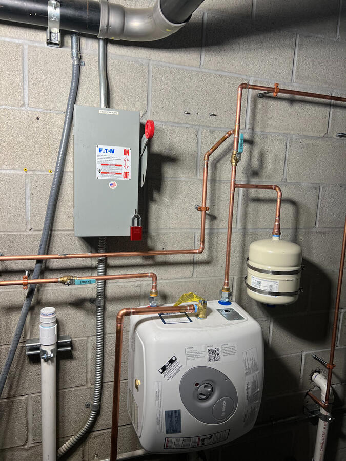 Water heater system with expansion tank and copper piping