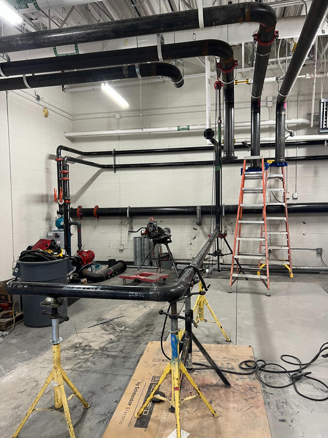 Indoor mechanical piping layout with dual pump configuration