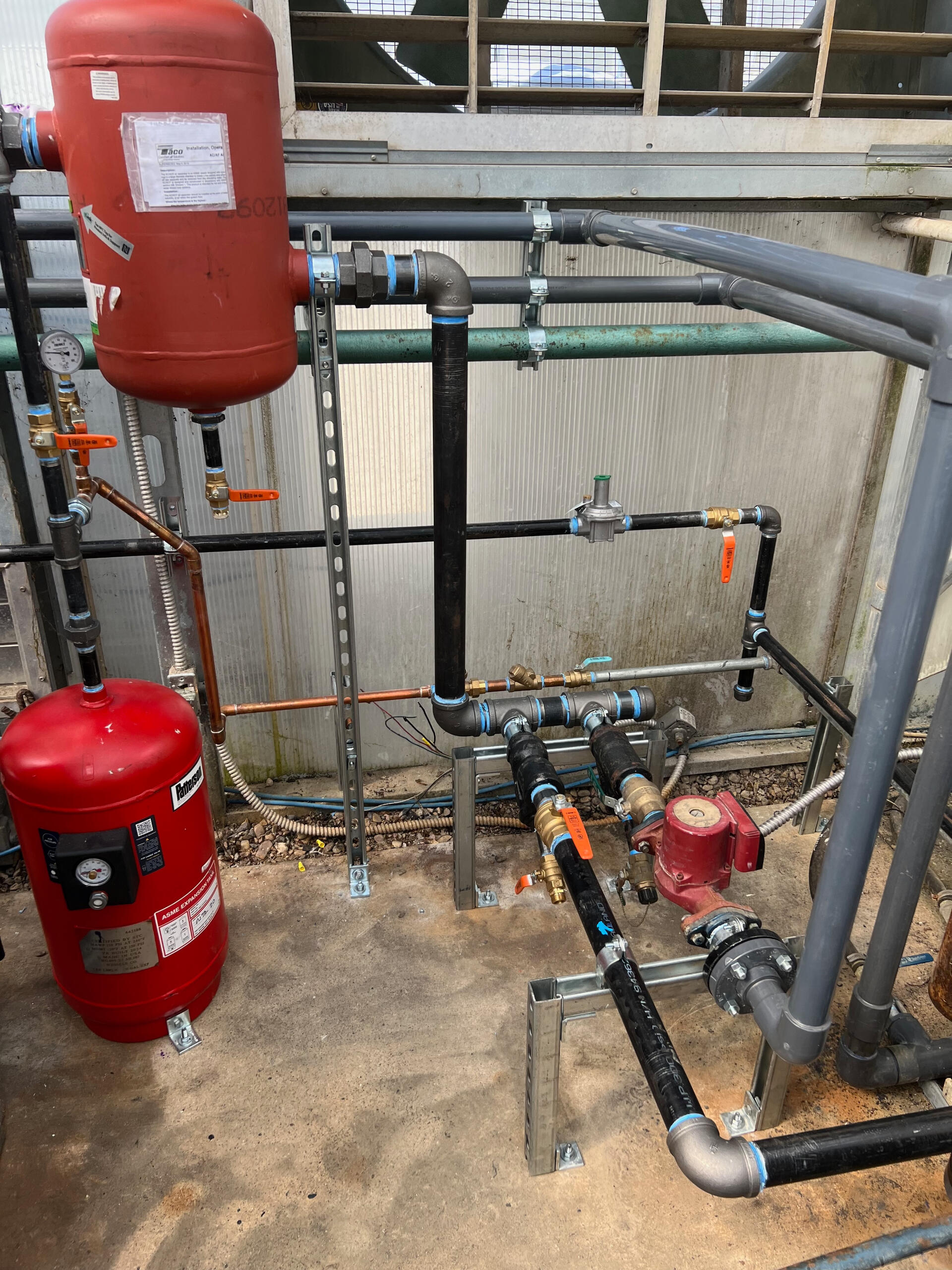 Custom commercial piping system installation with copper and blue valve components by Deseret Peak Piping
